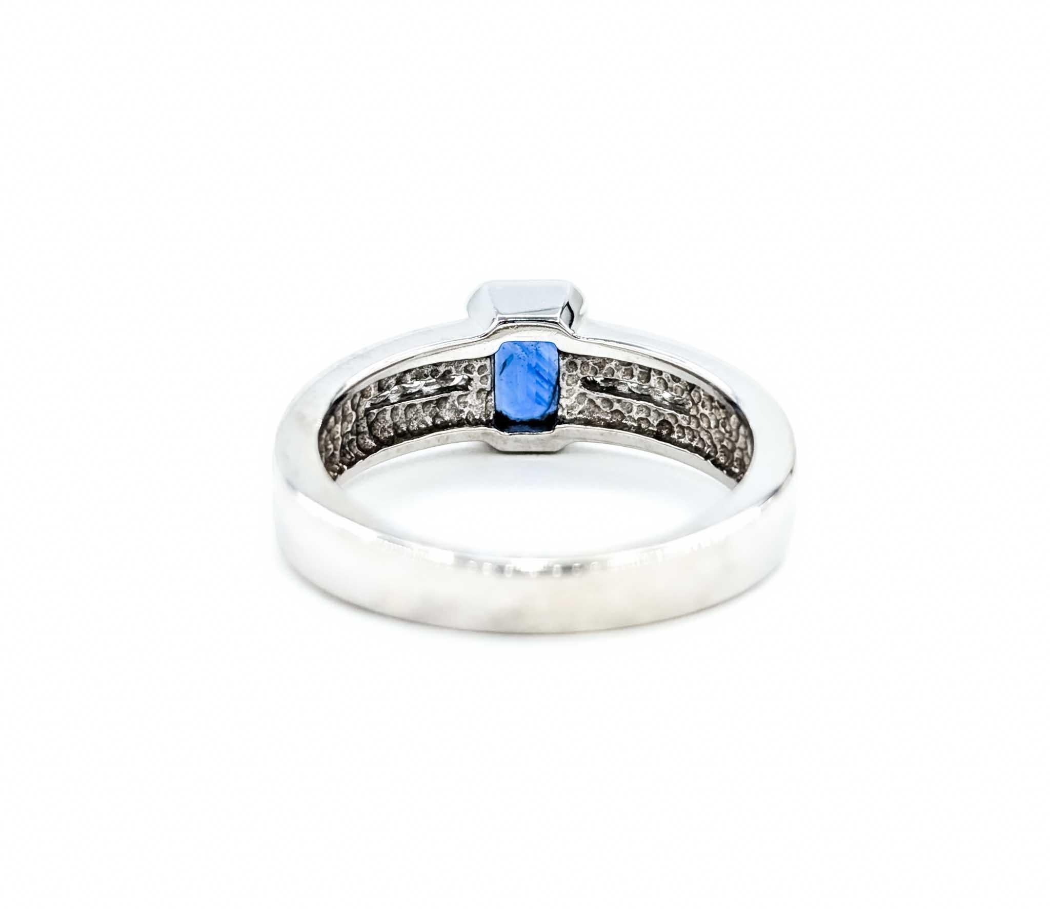 Emerald Cut Sapphire Ring with Channel Set Diamonds in White Gold For Sale 3
