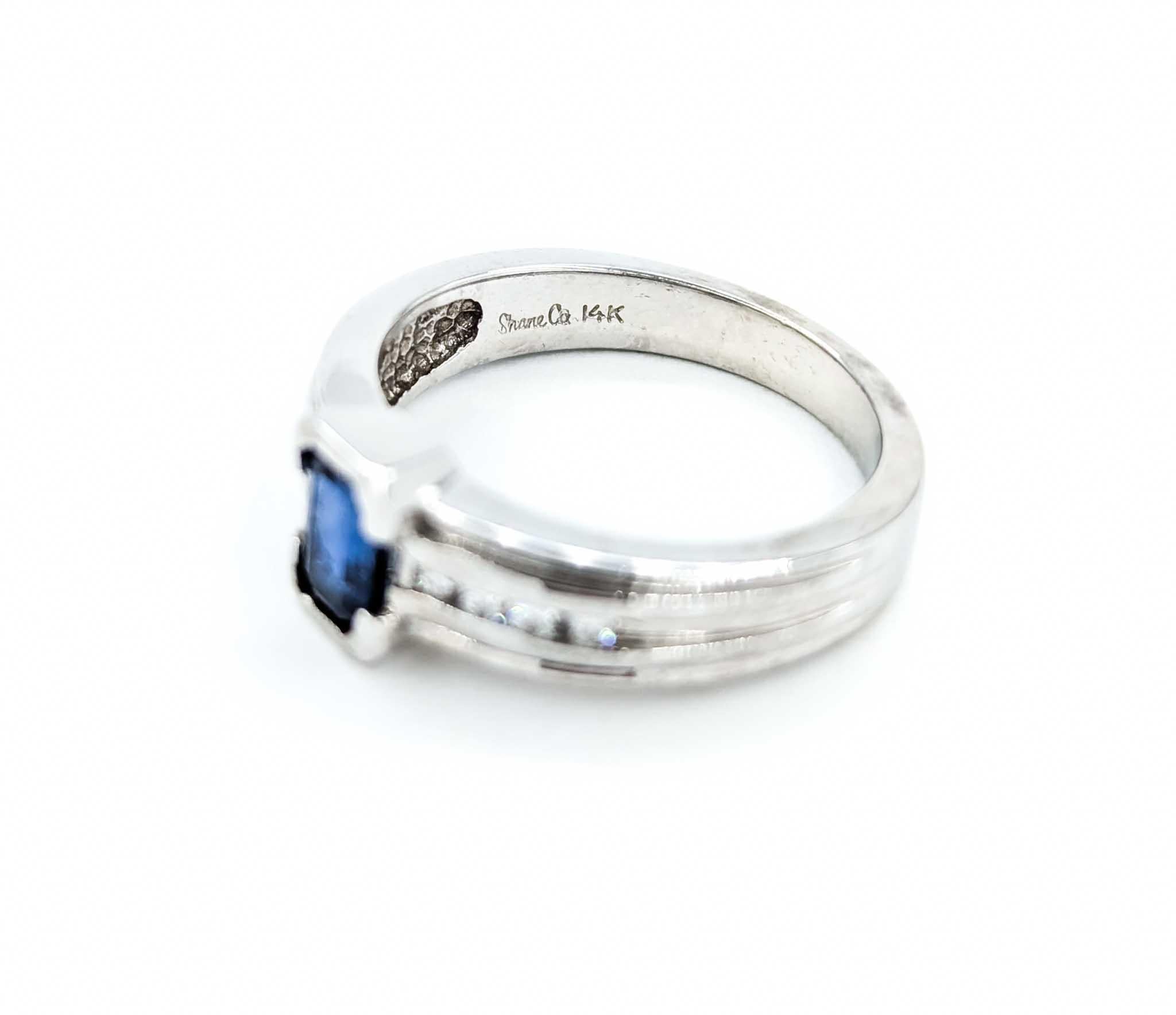 Emerald Cut Sapphire Ring with Channel Set Diamonds in White Gold For Sale 4