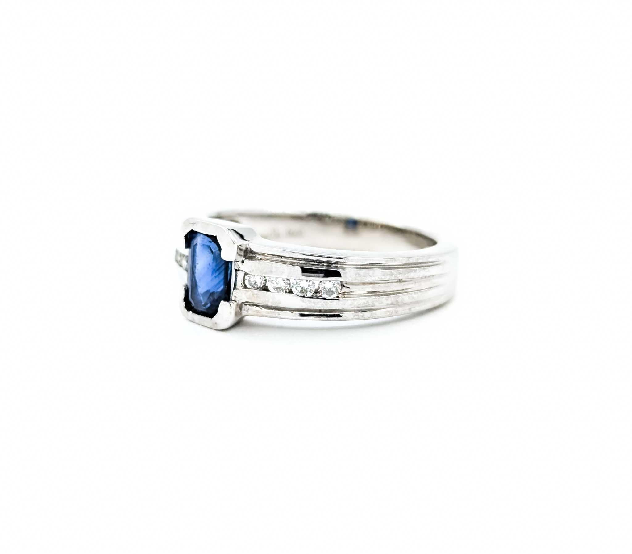 Emerald Cut Sapphire Ring with Channel Set Diamonds in White Gold For Sale 5