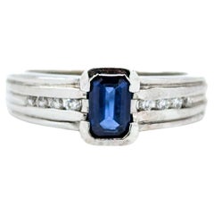 Emerald Cut Sapphire Ring with Channel Set Diamonds in White Gold