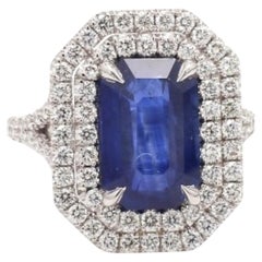 Emerald Cut Sapphire Ring with Round Diamonds