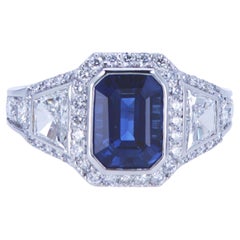 Emerald Cut Sapphire Ring with Trapezoid Diamonds
