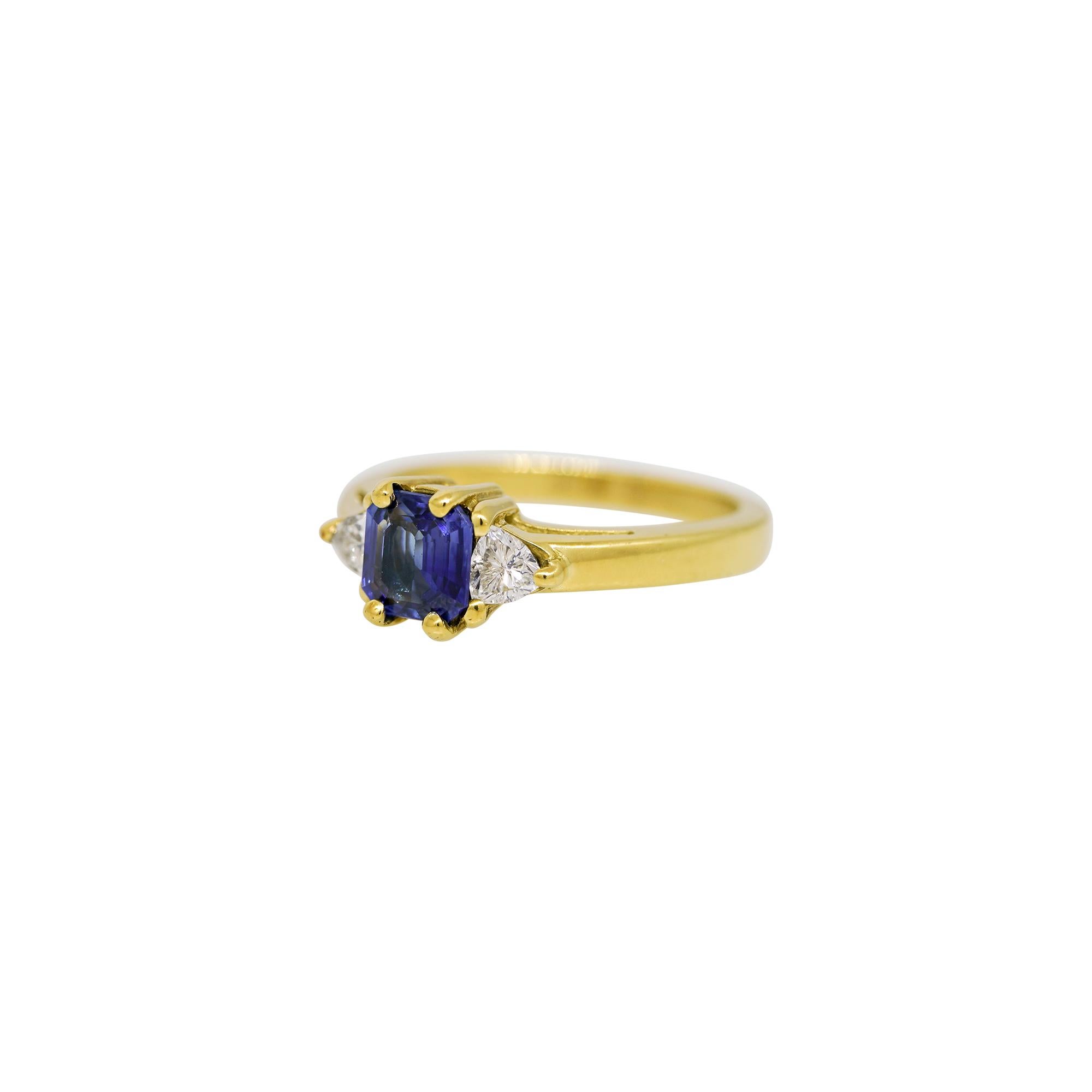 Modern Emerald Cut Sapphire & Trillion Cut Diamond Side Stone 18 Karat Ring In Stock For Sale