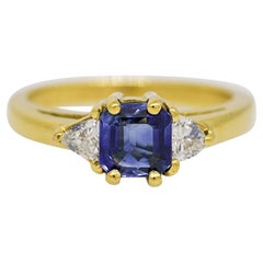 Emerald Cut Sapphire & Trillion Cut Diamond Side Stone 18 Karat Ring In Stock