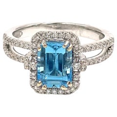 Emerald Cut Swiss Blue Topaz in 18K White Gold Halo Diamond Double Shank Setting
