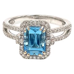 Emerald Cut Swiss Blue Topaz in 18K White Gold Halo Diamond Double Shank Setting