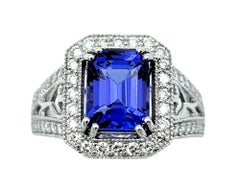 Emerald Cut Tanzanite & Diamond Halo Ring with Milgrain Detail in 18 Karat Gold