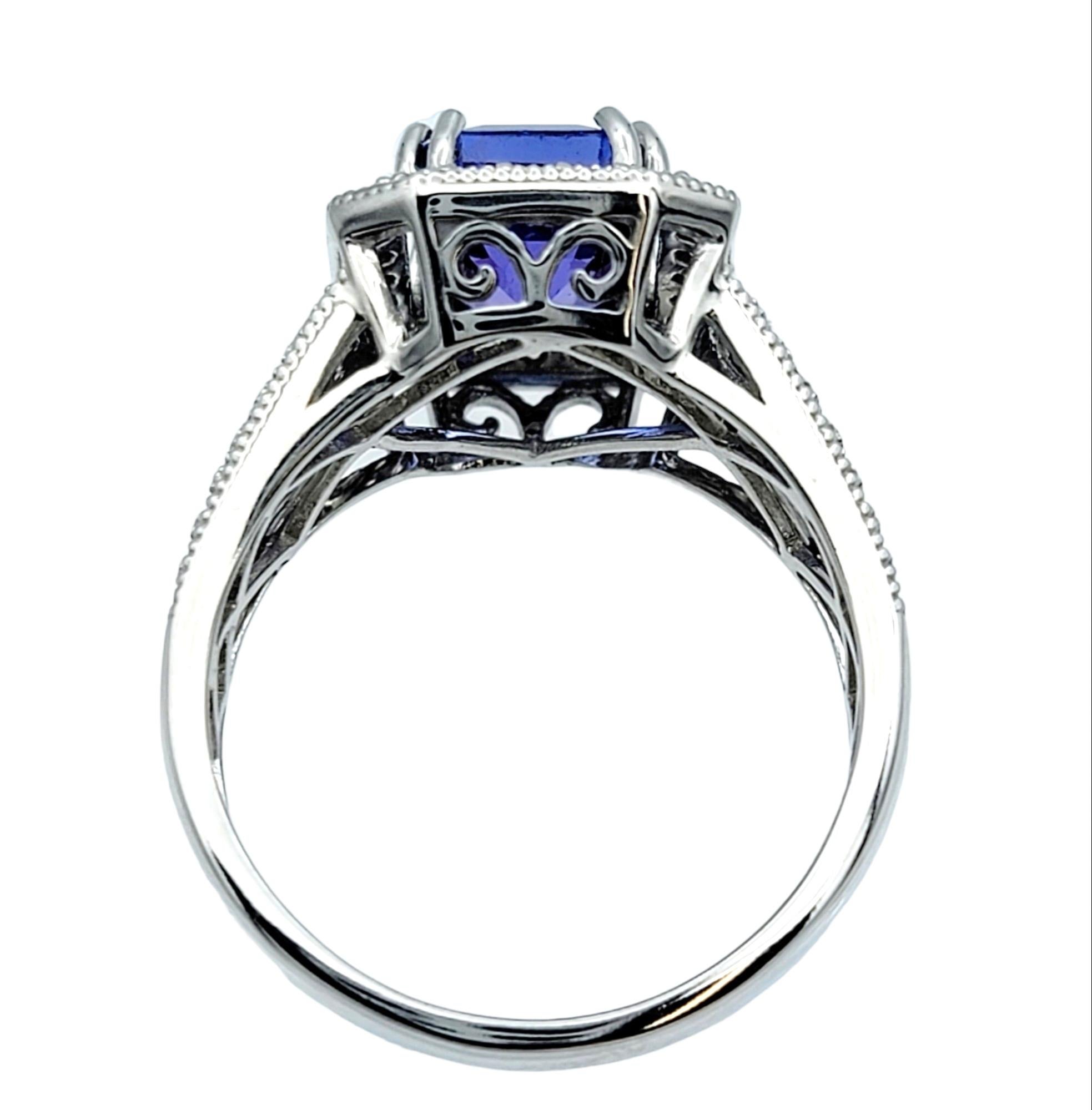 Women's Emerald Cut Tanzanite & Diamond Halo Ring with Milgrain Detail in 18 Karat Gold For Sale
