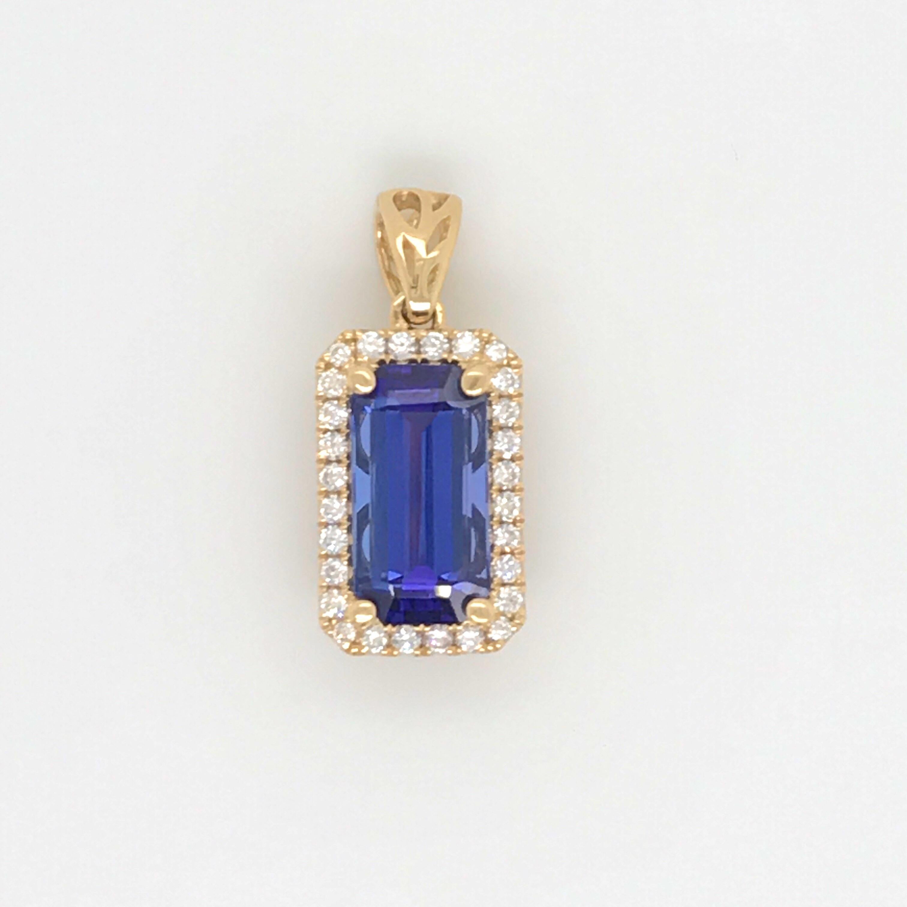 18K Yellow Gold pendant featuring one Emerald Cut Tanzanite, 3.41 Carats, flanked with a diamond halo setting weighing 0.26 carats.
Comes with a 18k yellow gold chain, 16 inches. 

Color G
Clarity VS-SI