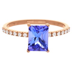 Bague artisanale en or rose 18 carats avec tanzanite taille émeraude et diamants