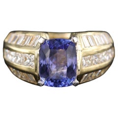 Verlobungsring aus 18 Karat Gold mit Tansanit im Smaragdschliff und Diamanten