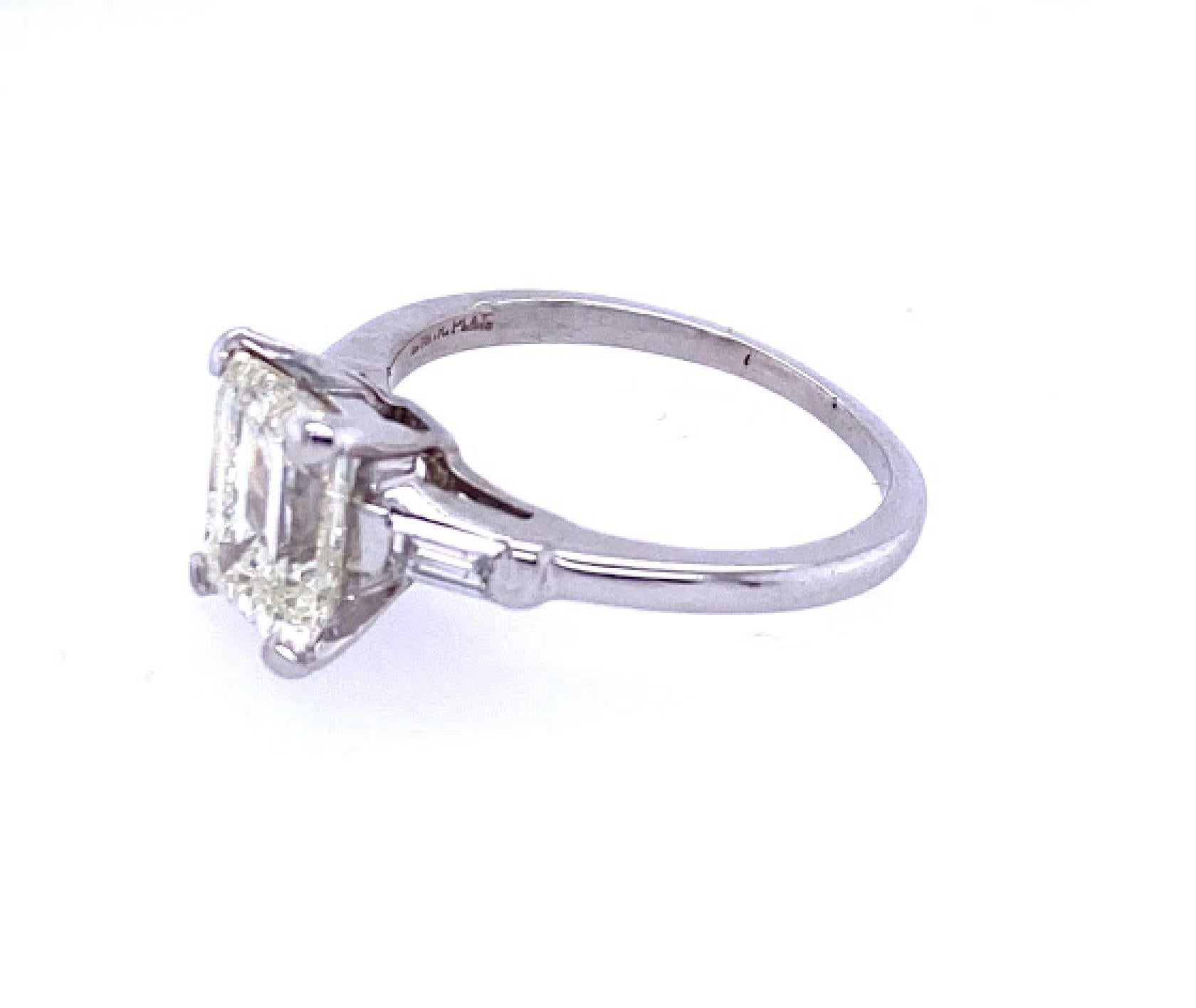 Modern Emerald Cut Three-Stone Engagement Ring