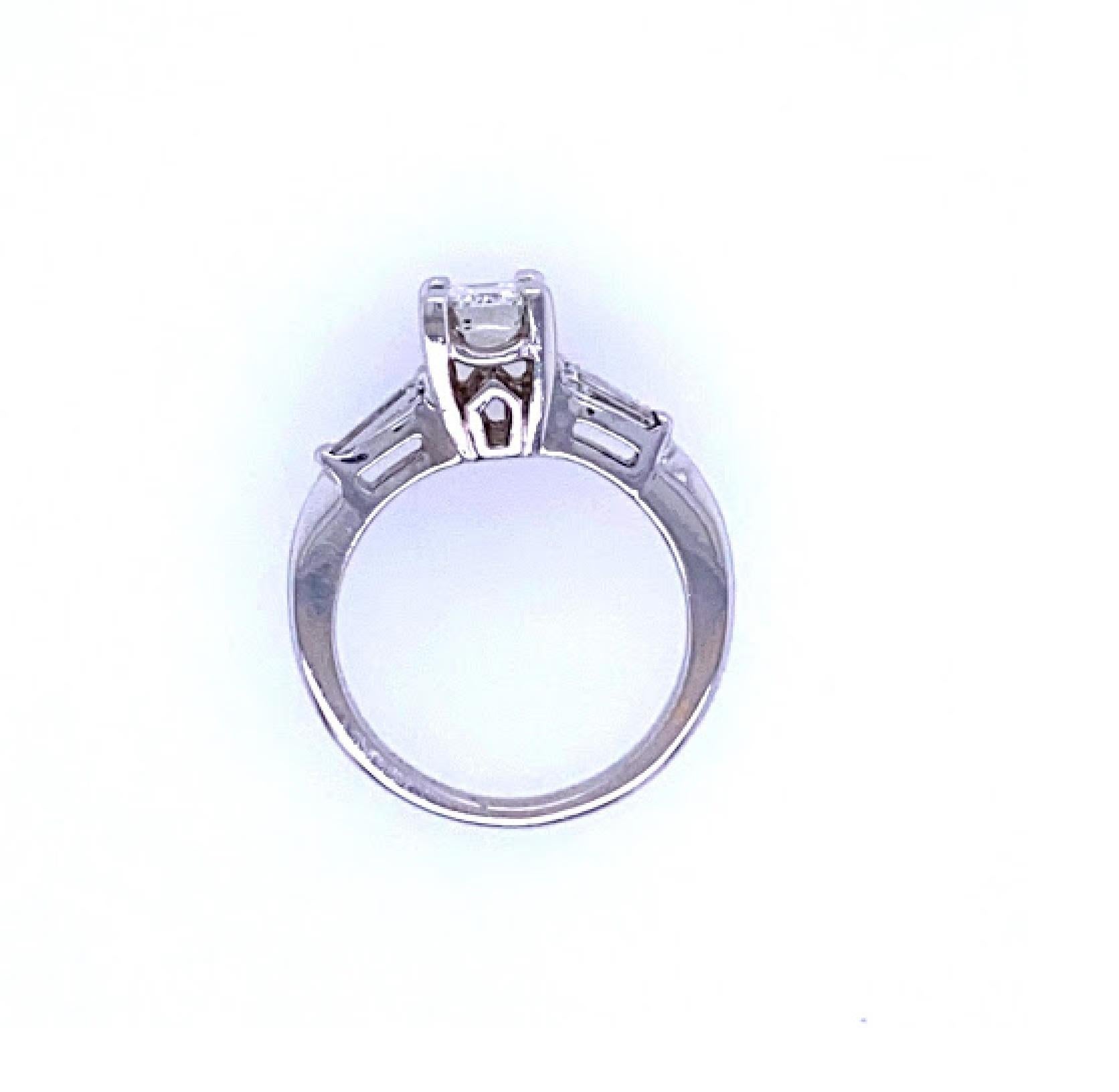 Modern Emerald Cut Three-Stone Engagement Ring