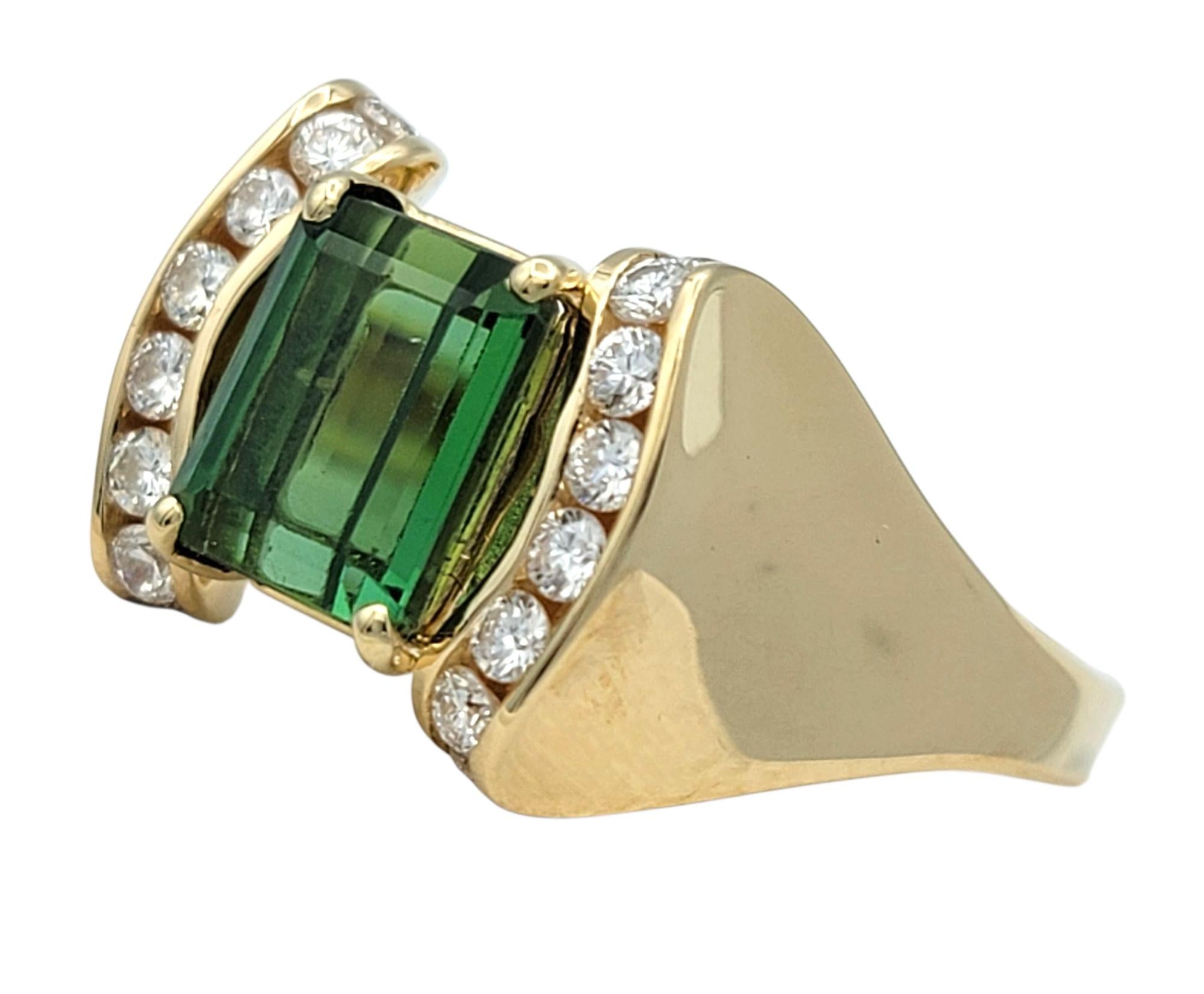 Ring Size: 8

This striking tourmaline and diamond ring captivates with a commanding emerald-cut green tourmaline at its center, exuding rich depth and clarity. The elongated cut highlights the gem’s vibrant green hue, while its facets lend a