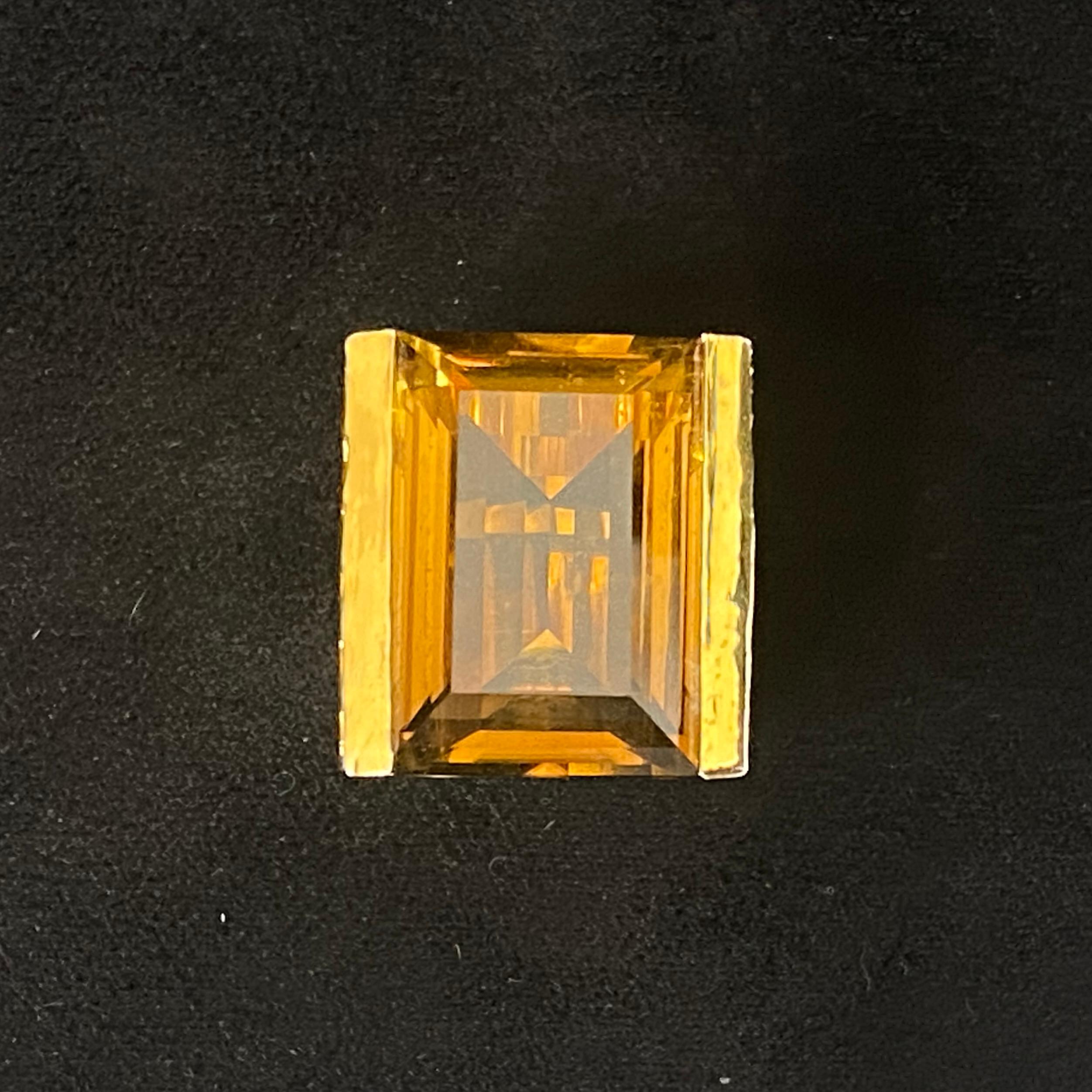 The large Emerald Cut Whiskey Quartz set within a deeply chiselled 'Brutalist' mount; this is a fabulously striking ring entering on a beautifully cut, bright & well proportioned stone. 

The stone measures 22mm x 15mm; the ring stands 11mm 'proud'
