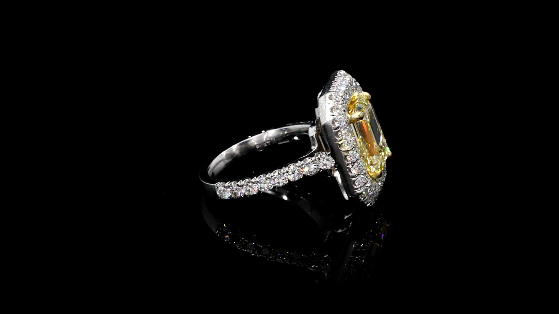 Emerald Cut Yellow Diamond Ring 6.12 carat Platinum/18KYG

Spectacular. Set in Platinum/18KYG

Stunning! Looks like nice FANCY YELLOW.

Emerald Cut weighs 4.01 carats

W-X  Color VVS1 Clarity GIA

Small Round Diamond weighs 2.11 carats

E/F Color VS