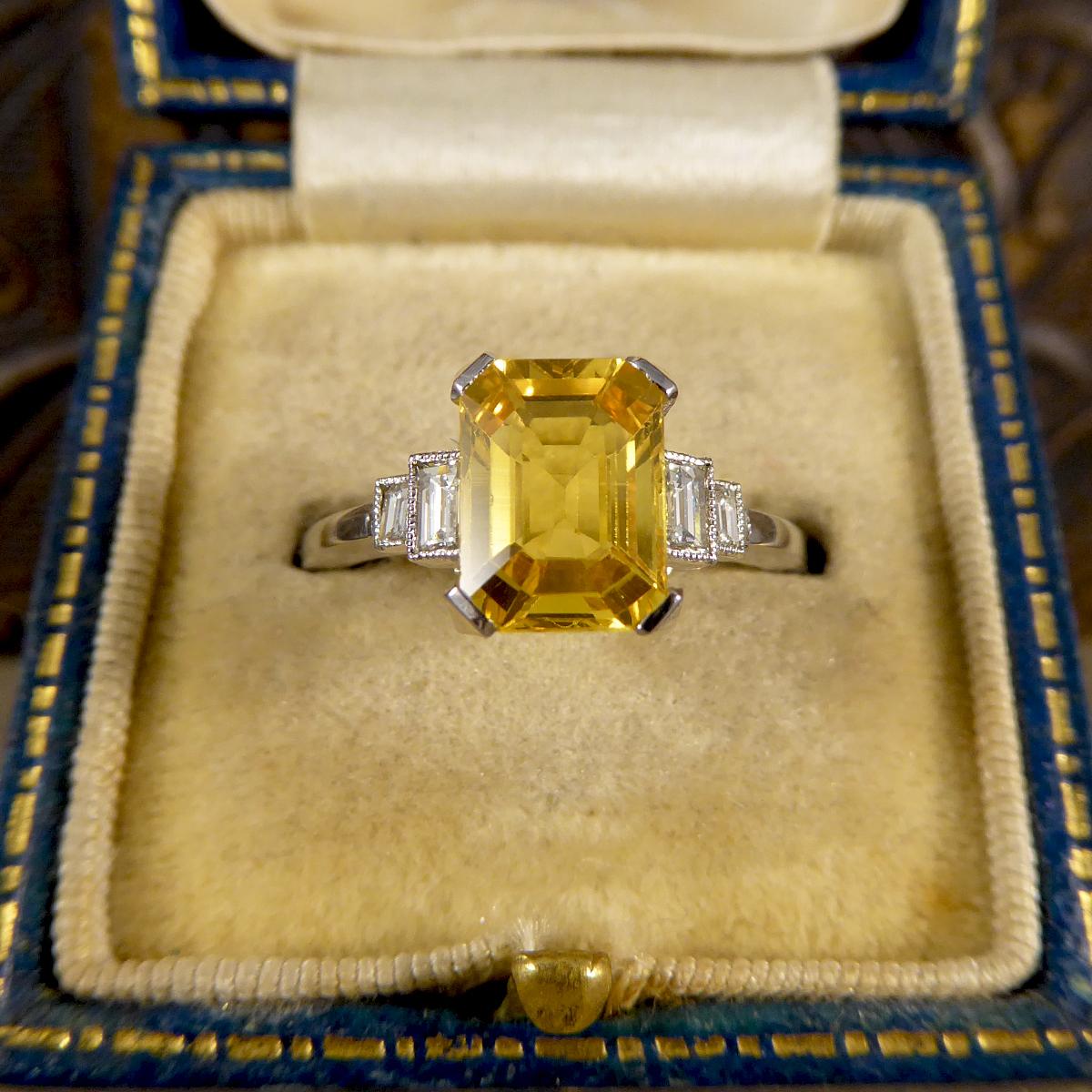 Contemporary Emerald Cut Yellow Sapphire with Baguette Cut Diamond Shoulders Ring in Platinum