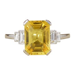 Emerald Cut Yellow Sapphire with Baguette Cut Diamond Shoulders Ring in Platinum