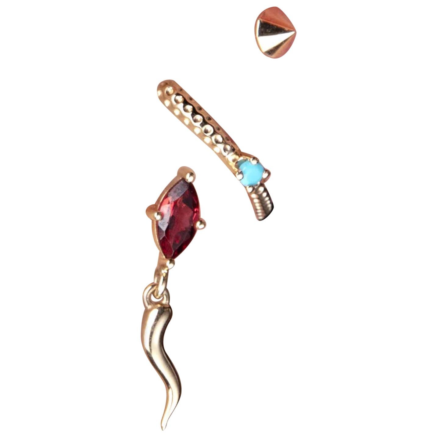 Crafted in 10 carat yellow gold with a selection of gemstones as Black Diamond, Garnet, Emerald, Turquoise, Tsavorite, Pink Sapphire, Ruby, MICROCOSMO collection lies in the transformation of shapes borrowed from IOSSELLIANI’ s archive. 
This