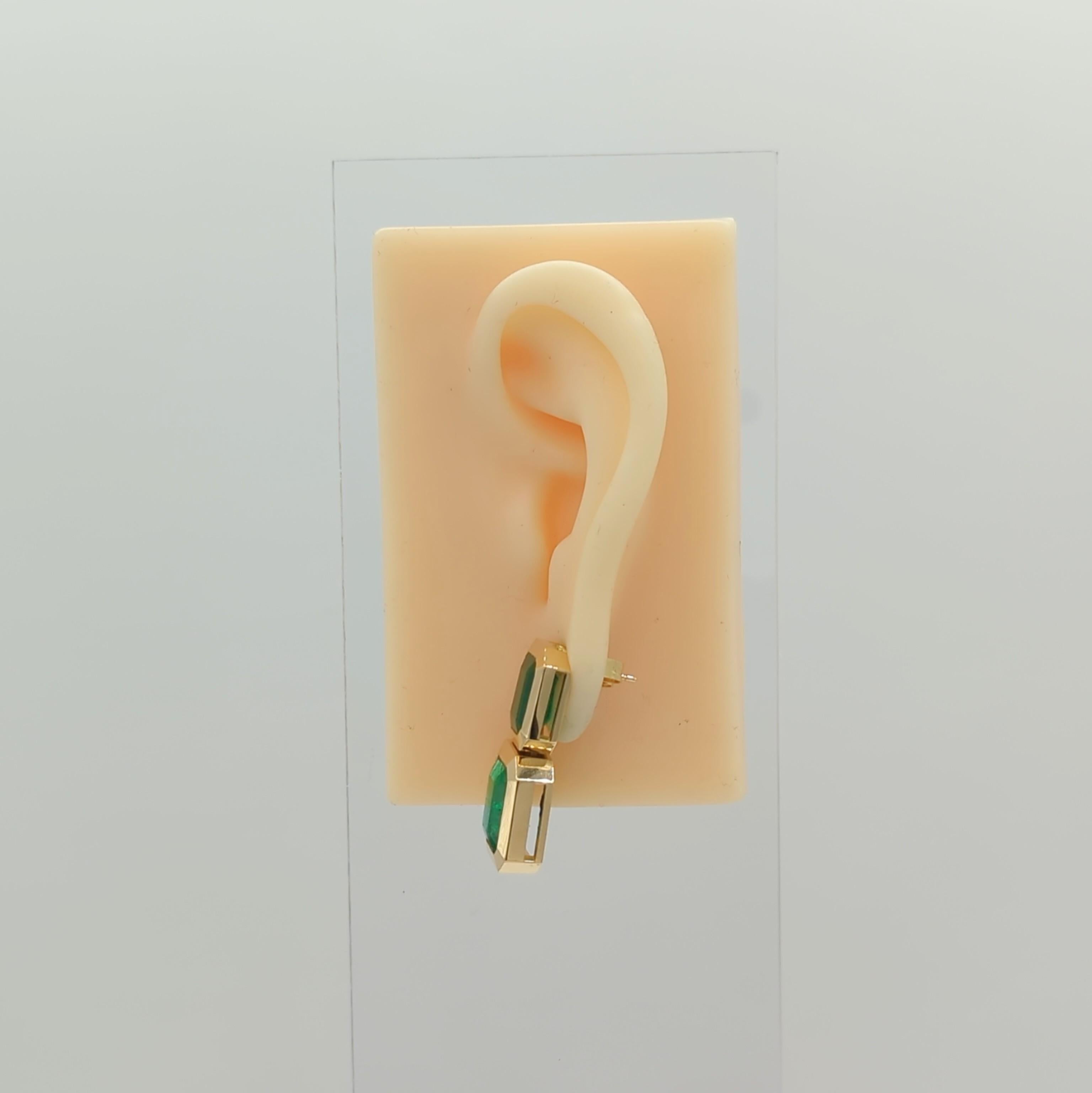 Emerald Cut Emerald Dangle Earrings in 18K Yellow Gold For Sale