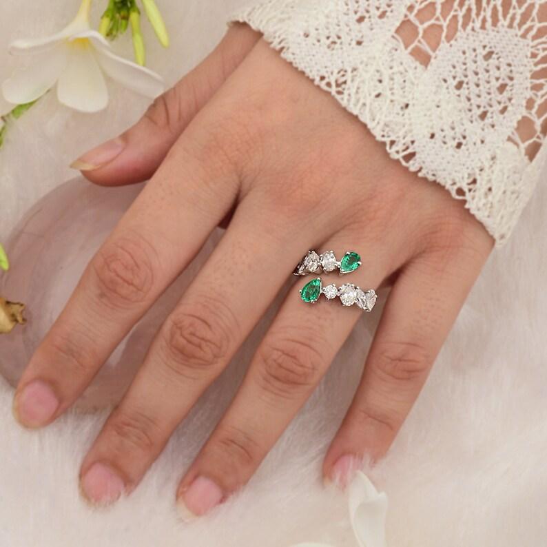 This ring has been meticulously crafted from 14-karat gold.  It is hand set with .72 carats emerald & 1.50 carats of sparkling diamonds. Available in white, rose and yellow gold.

The ring is a size 7 and may be resized to larger or smaller upon