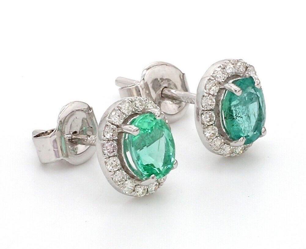 Cast in 14 karat white gold, these stud earrings are hand set with 1.30 carats emerald and .30 carats of glimmering diamonds. 

FOLLOW MEGHNA JEWELS storefront to view the latest collection & exclusive pieces. Meghna Jewels is proudly rated as a Top