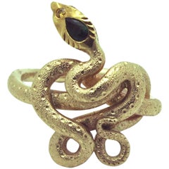 Bague serpent en or 14 carats avec diamants et émeraude