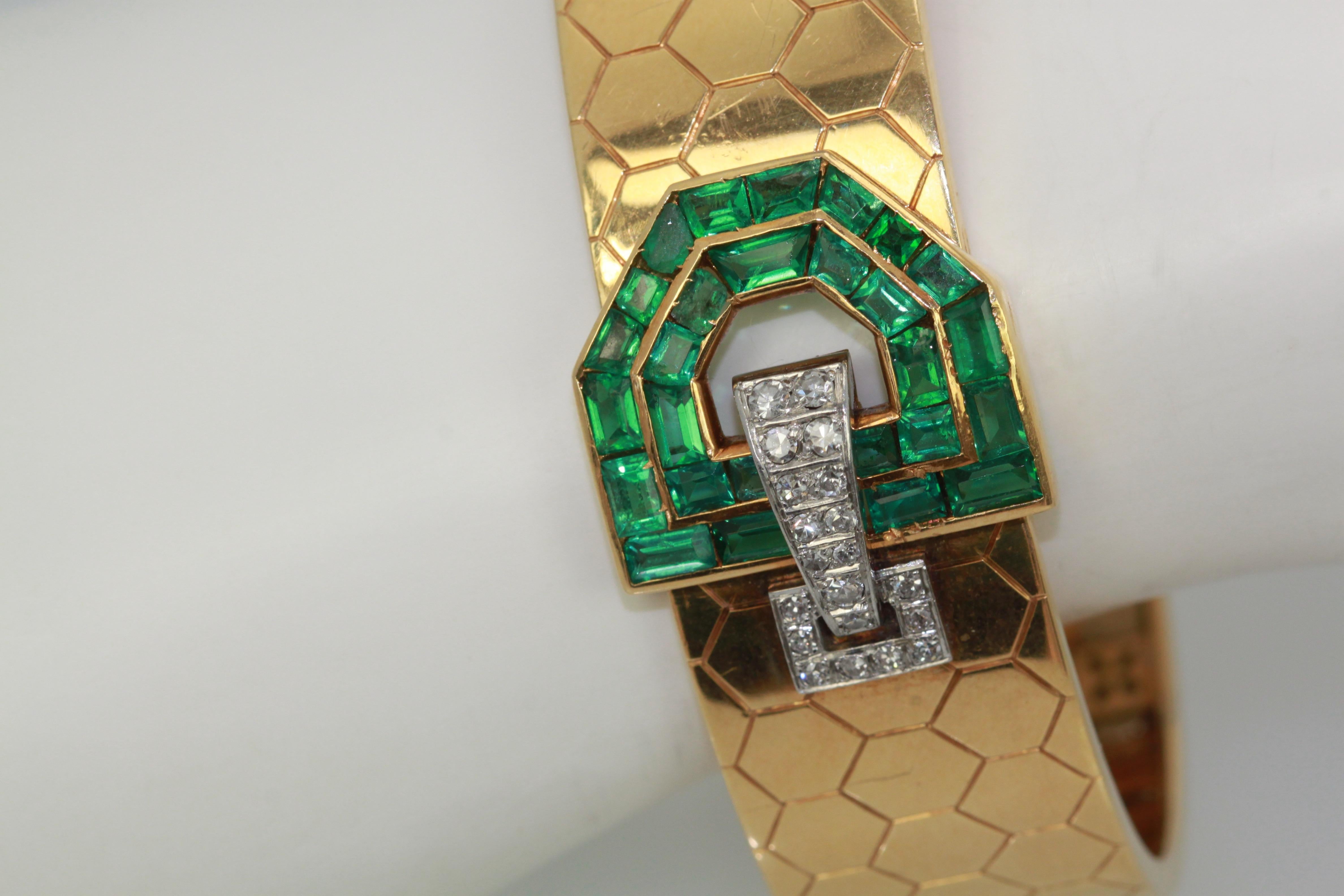 This Honeycomb Bracelet is set with Emeralds and Diamonds in a buckle style.  This comes from Austria and boosts 30 Baguette Emeralds totalling approximately 4 carats and 20 Diamonds in a lovely bracelet.  This fits a size 6 1/2 and the weight is