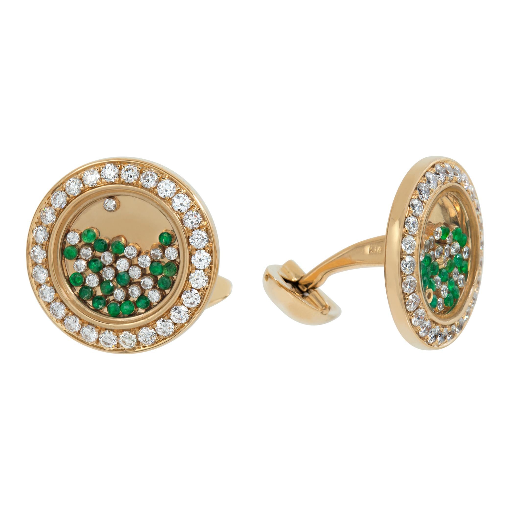 Cufflinks with moving Emerald & diamonds under glass in 14k yellow gold. Round brilliant cut diamonds total approx. weight: 1.80 carat, estimate G-H color, VS-SI clarity. Round brilliant cut Emeralds total approx. weight: 0.46 carat. Diameter: 20mm.