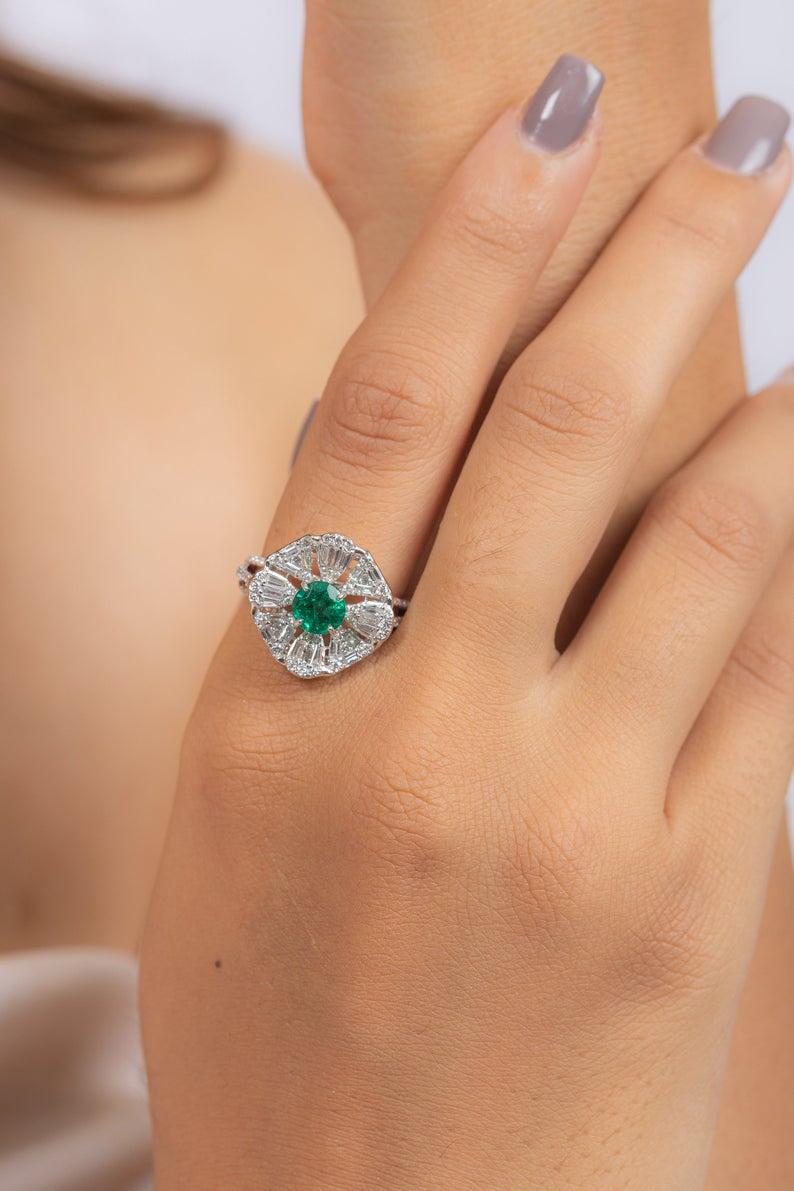This ring has been meticulously crafted from 18-karat gold.  It is hand set with 1.01 carats emerald & 1.40 carats of sparkling diamonds. 

The ring is a size 7 and may be resized to larger or smaller upon request. 
FOLLOW  MEGHNA JEWELS storefront