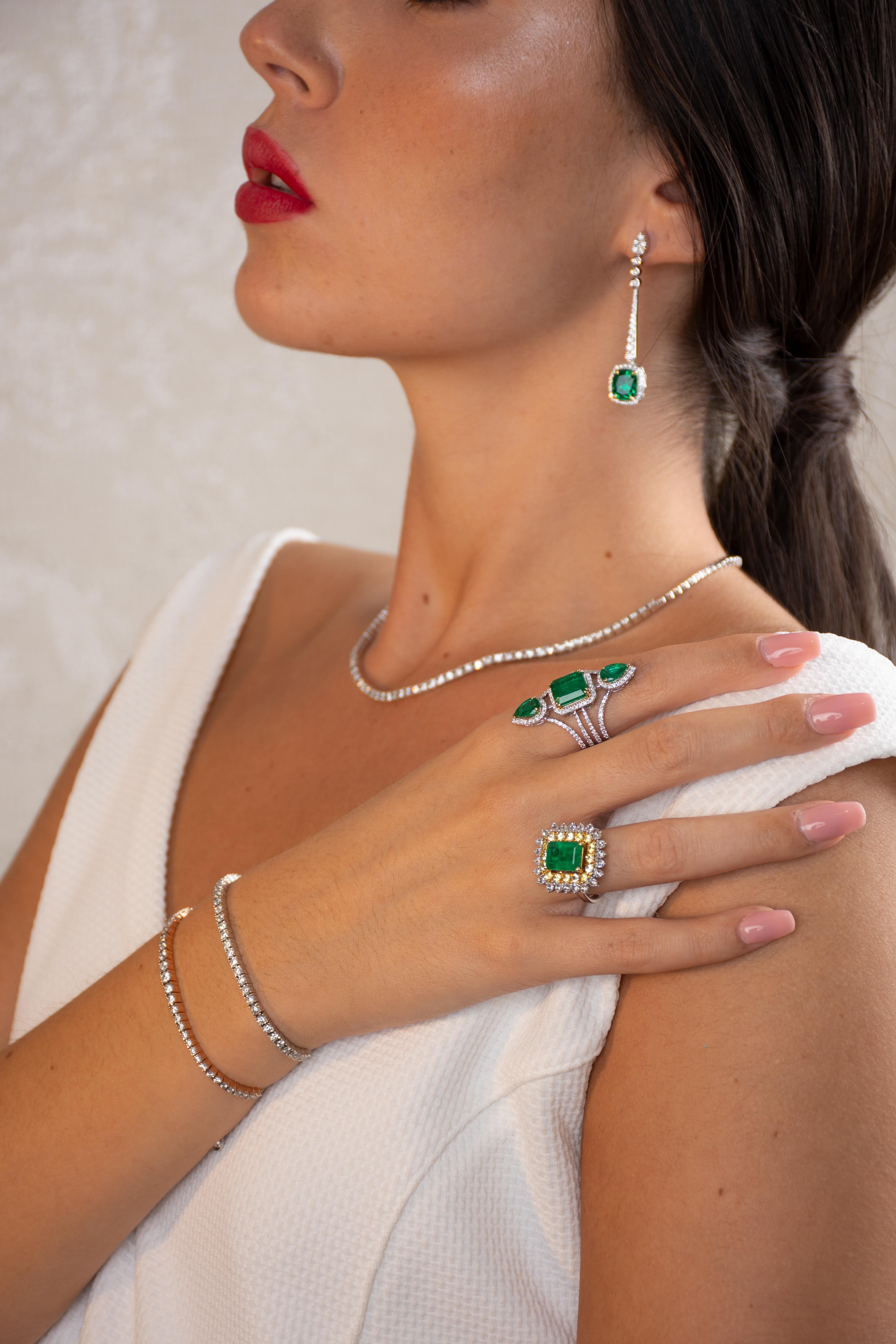 These exquisite drop earrings are handmade in 14-karat gold and set with 4.44 carats emerald and 4.44 carats of sparkling diamonds. 

Diamond color GH
Diamond Clarity VS2 SI1.

FOLLOW  MEGHNA JEWELS storefront to view the latest collection &
