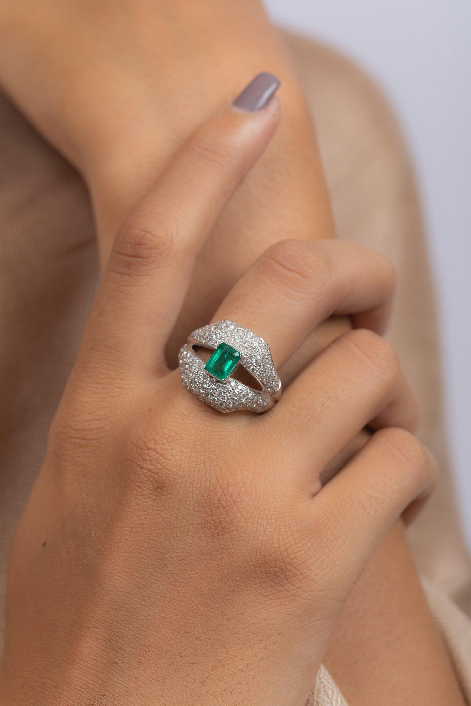 This ring has been meticulously crafted from 14-karat gold.  It is hand set with 1.0 carat emerald & 1.55 carats of sparkling diamonds. 

The ring is a size 7 and may be resized to larger or smaller upon request. 
FOLLOW  MEGHNA JEWELS storefront to