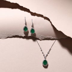 Emerald & Diamond Accented Earrings in 18K White Gold