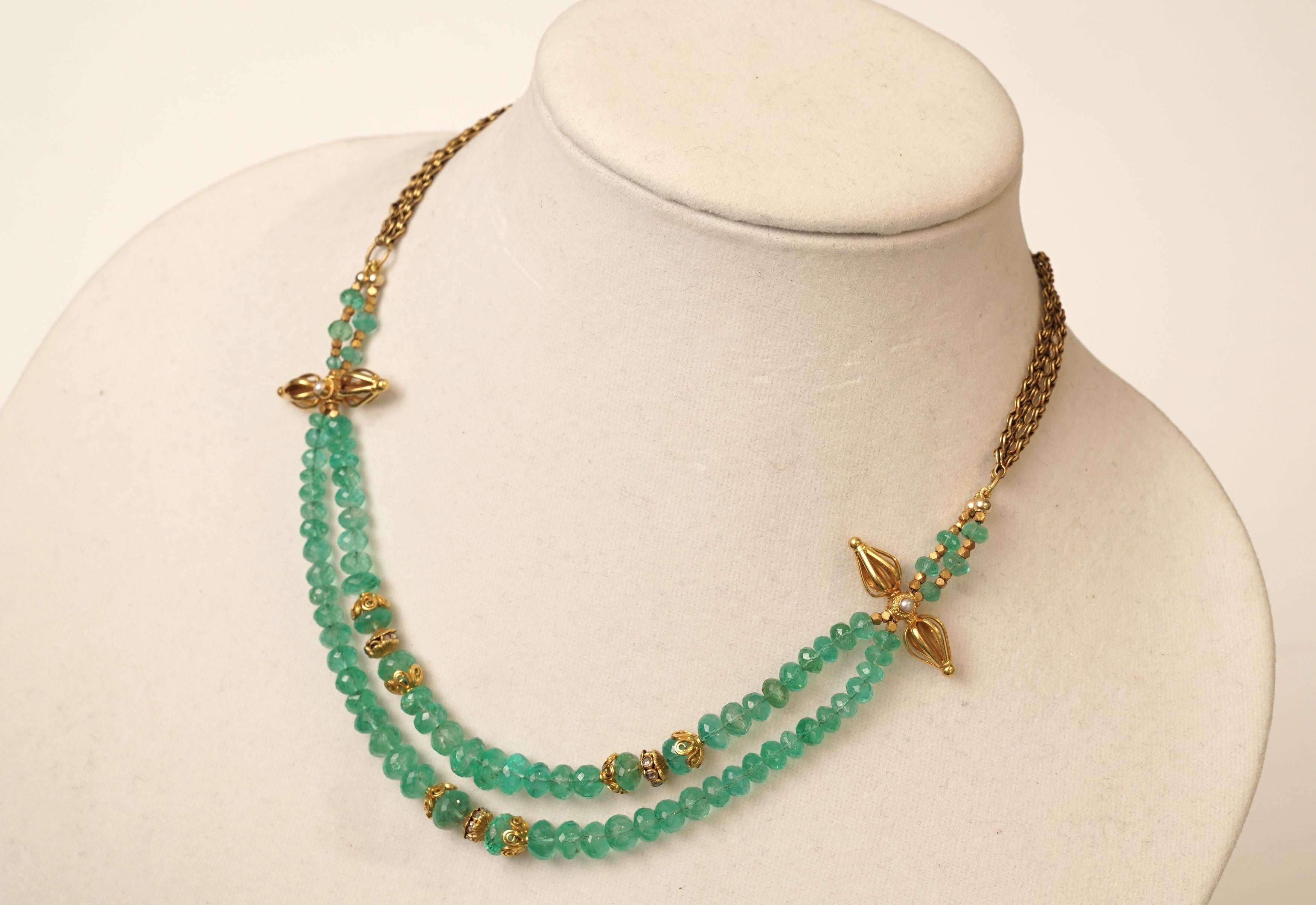 A double strand of quality, large faceted Colombian emerald beads with diamond rondelles and 22K gold.  Hand-made double chain of gold at the back and and optional length of 16 - 18