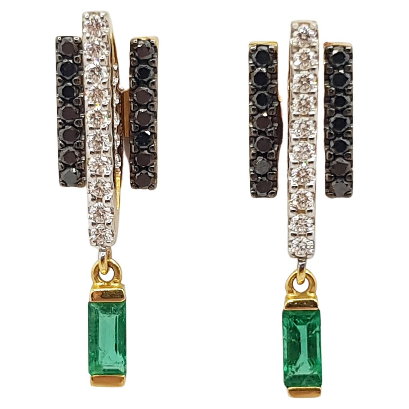 Emerald 0.42 carat, Diamond 0.27 carat and Black Diamond 0.31 carat GeoArt Earrings set in 18 Karat Gold Settings by Kavant & Sharart

Width:  0.7 cm 
Length:  2.4 cm
Total Weight: 6.06 grams


