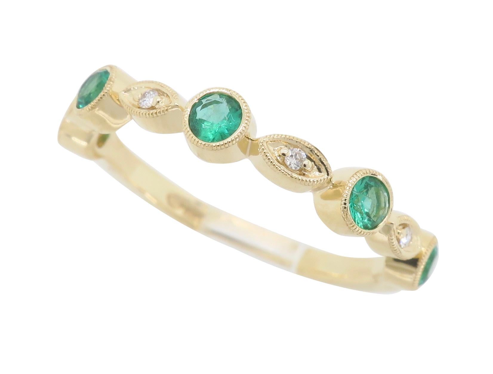 Mil-grain detailed band with alternating Round Cut Emeralds and Round Brilliant Cut Diamonds crafted in 14K yellow gold.

Gemstone: Emerald & Diamond
Gemstone Carat Weight: 5 Approximately 2.6mm Round Cut Emeralds
Diamond Carat Weight: 