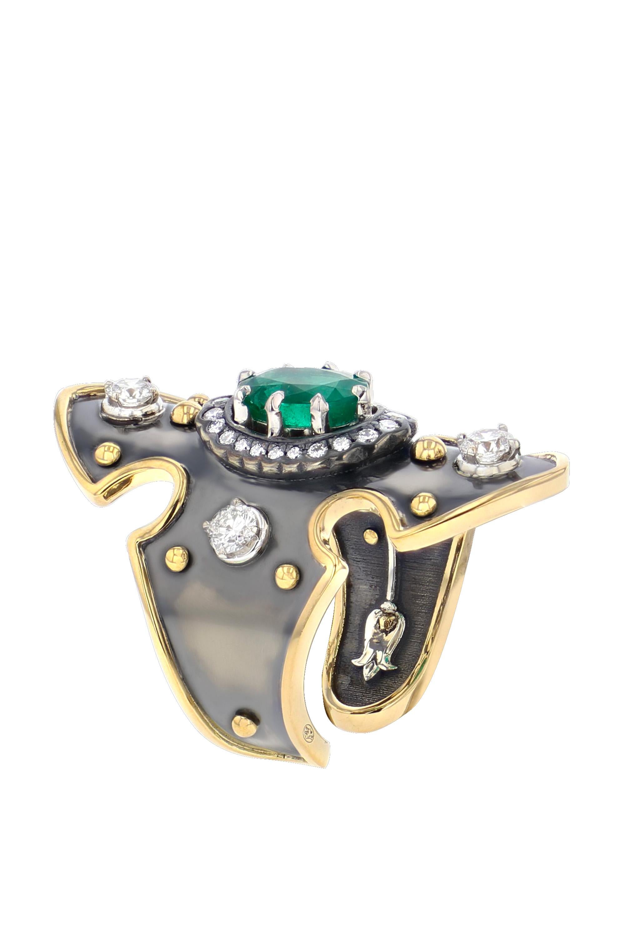 Yellow gold and distressed silver ring studded with an oval emerald surrounded by diamonds.

Details:
Oval Emerald: 8x6x1.3 cts  
26 Diamonds: 0.57 cts
18k Gold: 5g 
Distressed Silver: 6.5g  
Made in France