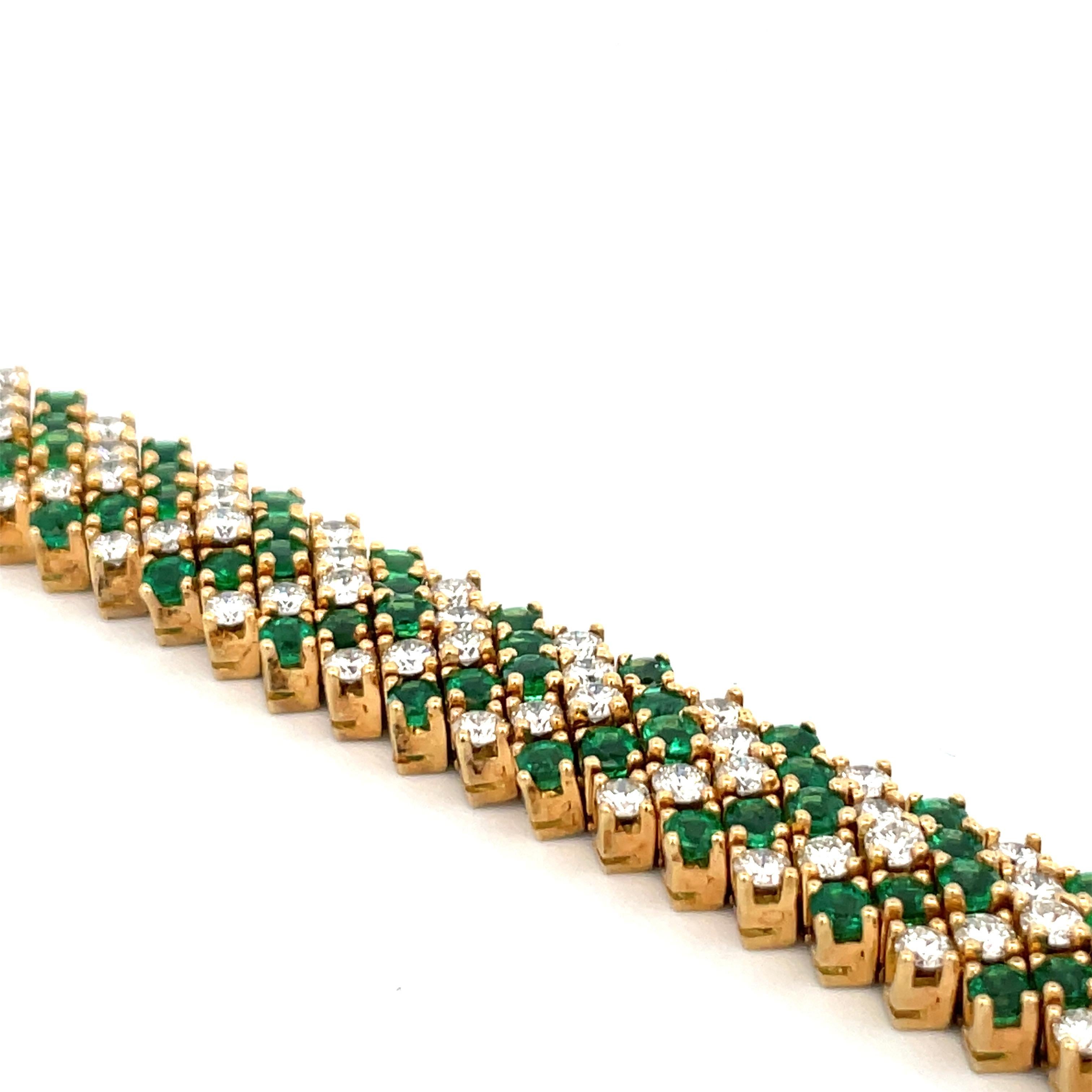 18 Karat yellow gold bracelet featuring diamond and green emeralds in a chevron motif design. 
Green Emerald - 6.50 Carats
Diamonds - 6.90 Carats