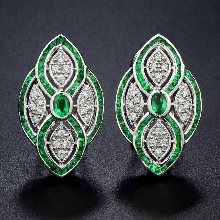 The elegance of French Cut Emerald from Zambia Total 110 Pieces 2.52 Carat, perform a perfect beautiful line in this Earrings.  it also set with 36 Pieces 0.36 Carat Diamond.  This earring was made in Clip-on Style.