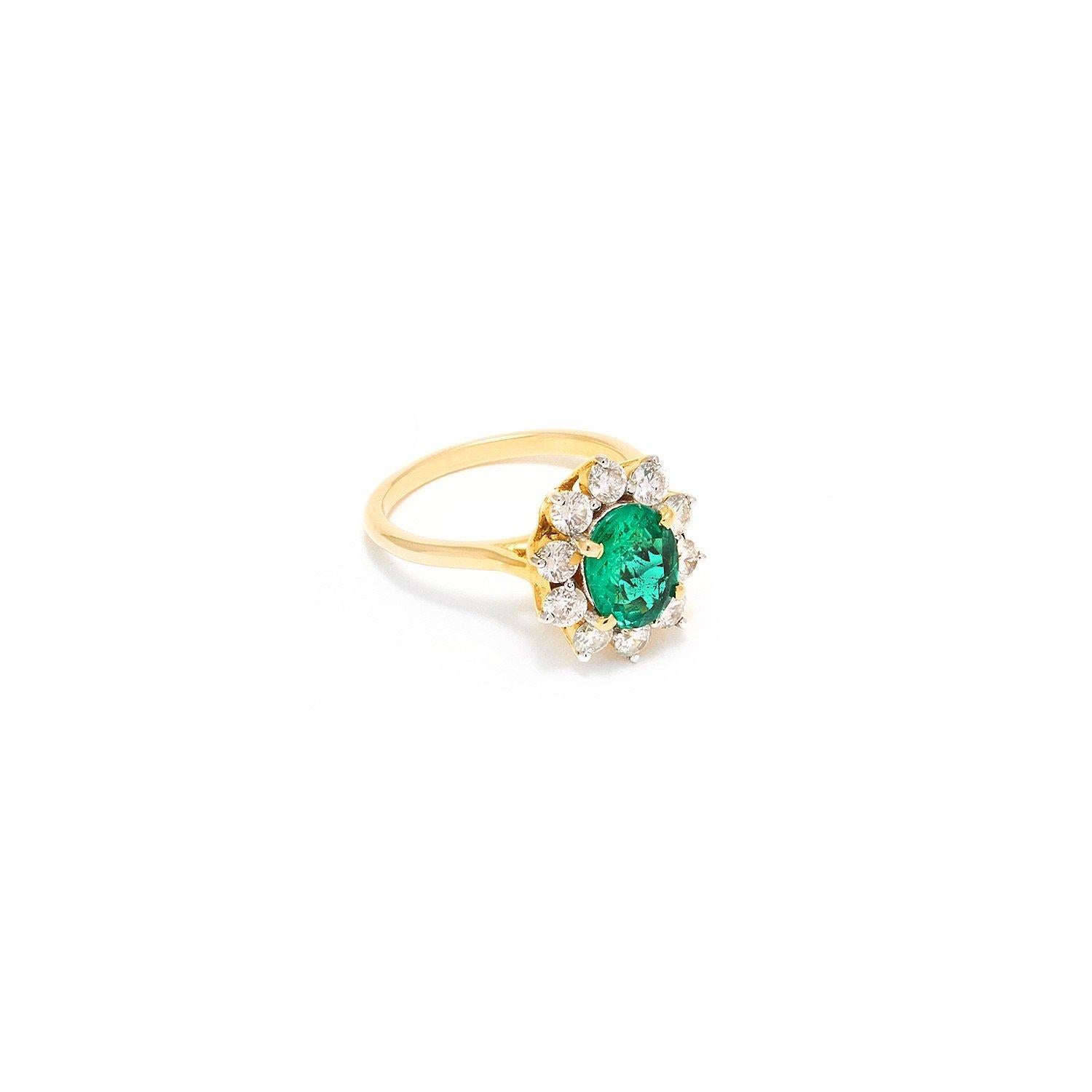 A beautiful dress ring featuring a fiery Emerald set with a cluster of fine quality Brilliant Cut White Diamonds on a Gold band.

- Zambian Emerald 1.93 Carats.
- Certified Natural with no enhancements certificate will be supplied.
- Brilliant Cut