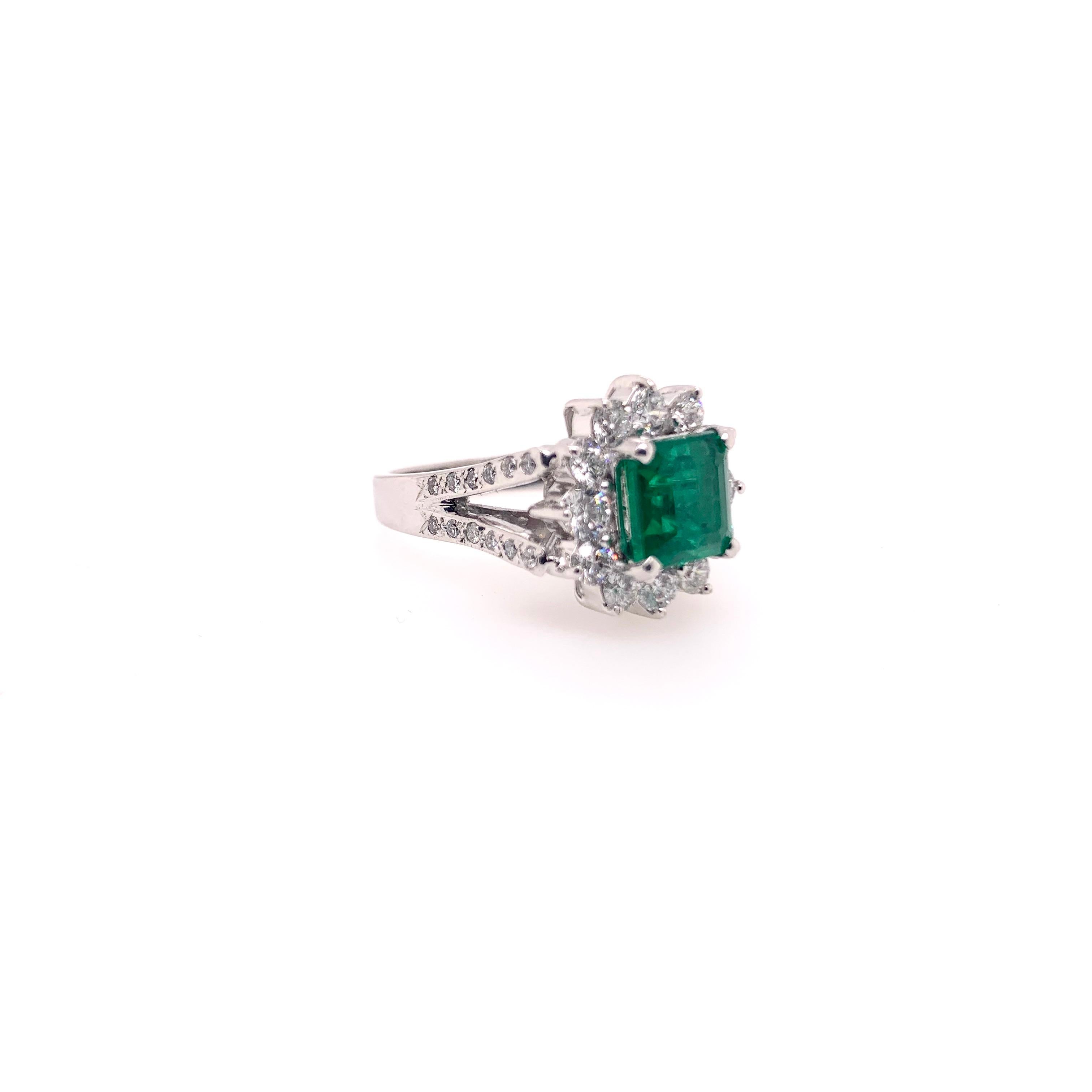 This stunning emerald ring is is a timeless design that will be in style for decades and generations.  The square cut emerald is surrounded by round brilliant diamonds which then leads to a V-shank with round brilliant diamonds.  The mounting is
