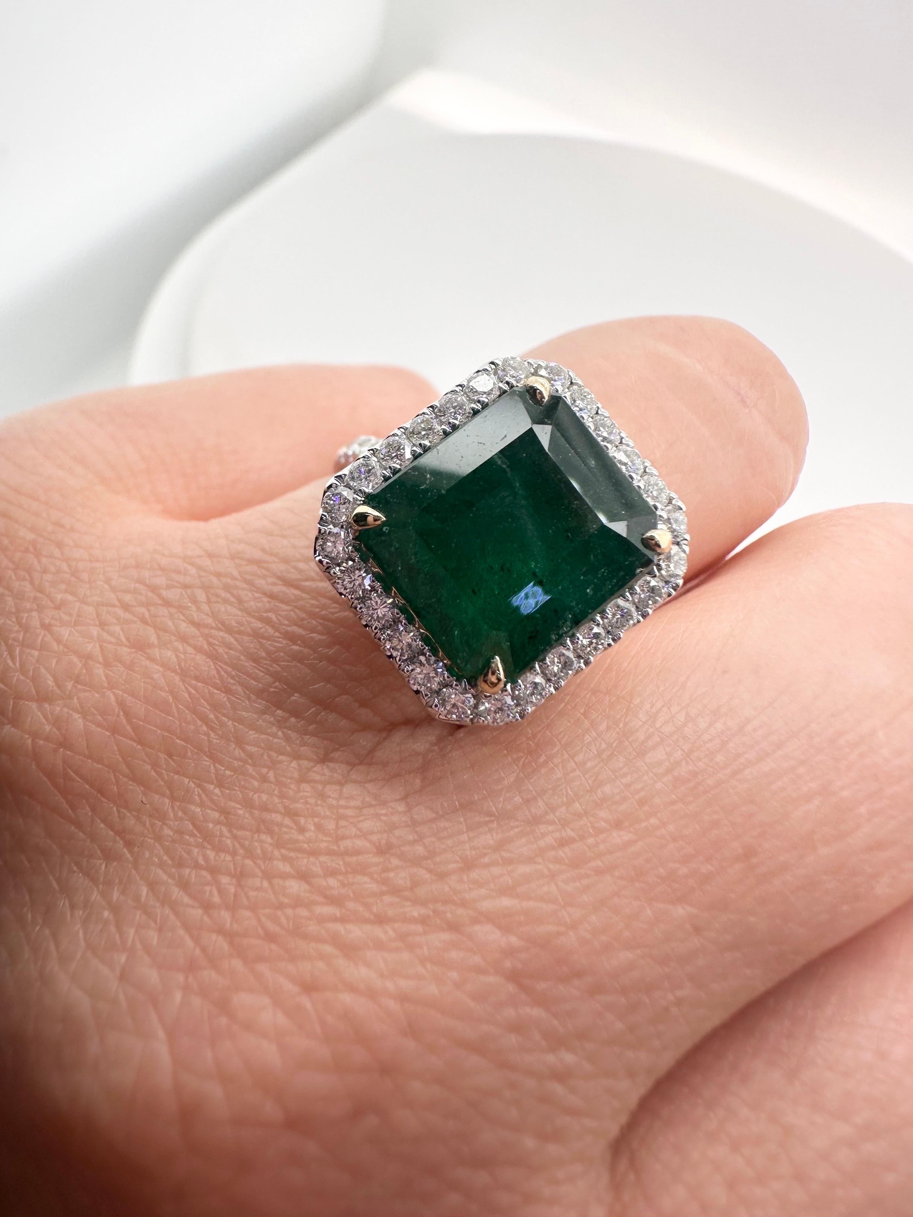 One of a kind green Emerald diamond ring, made in gorgeous cocktail style in 18KT gold.

Metal Type: 18KT
Gram Weight:6.27 grams 

Natural Emerald(s):
Color: Green
Cut:Emerald
Carat: 7.49ct
Clarity: Moderately Included

Natural Diamond(s): 
Color: