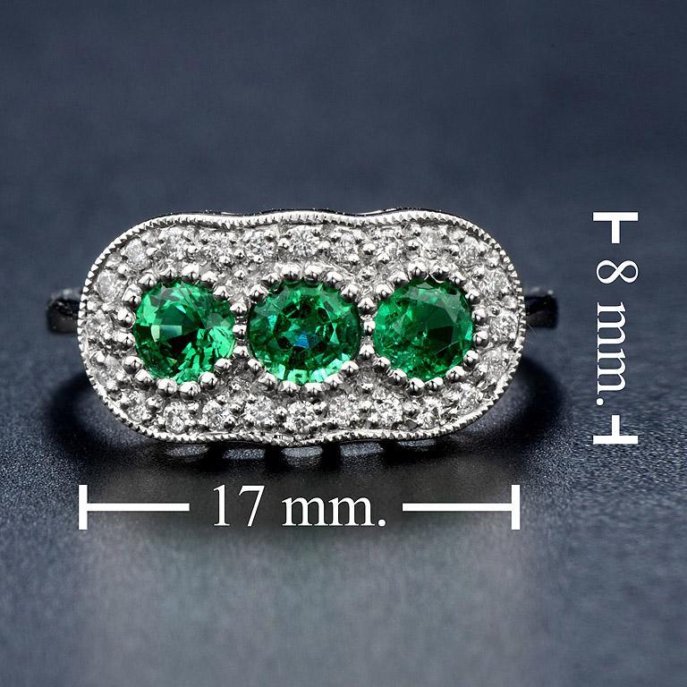 For Sale:  Round Emerald with Diamond Three Stone Ring in 18K White Gold 7