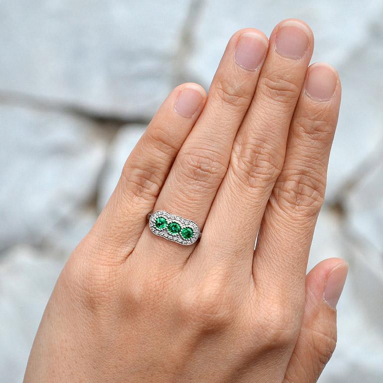 For Sale:  Round Emerald with Diamond Three Stone Ring in 18K White Gold 8
