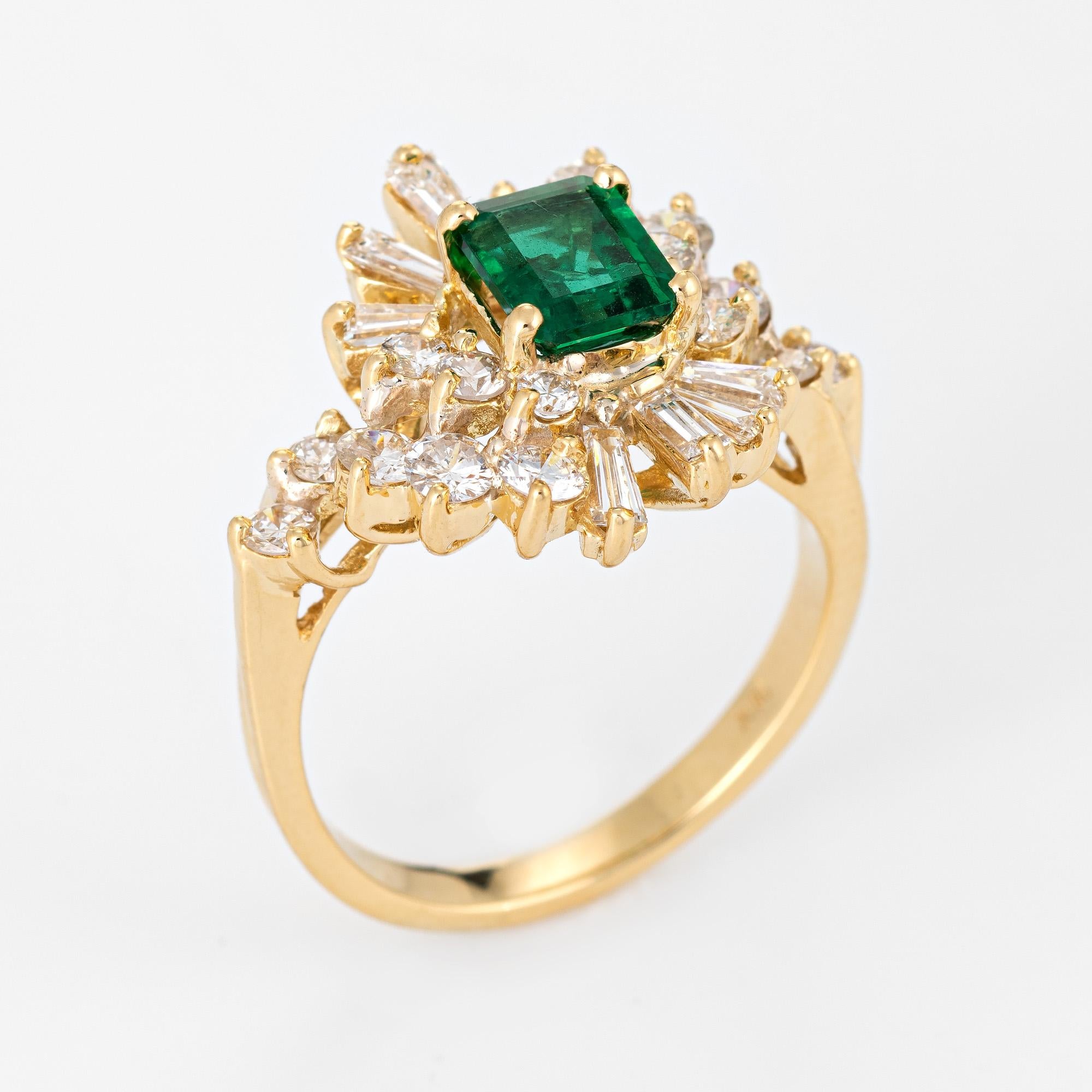 Stylish vintage emerald & diamond cocktail ring (circa 1980s) crafted in 18 karat yellow gold. 

Emerald cut emerald measures 6.5mm x 5.5mm (estimated at 1 carat), accented with an estimated 1 carat of mixed cut diamonds (round brilliant &