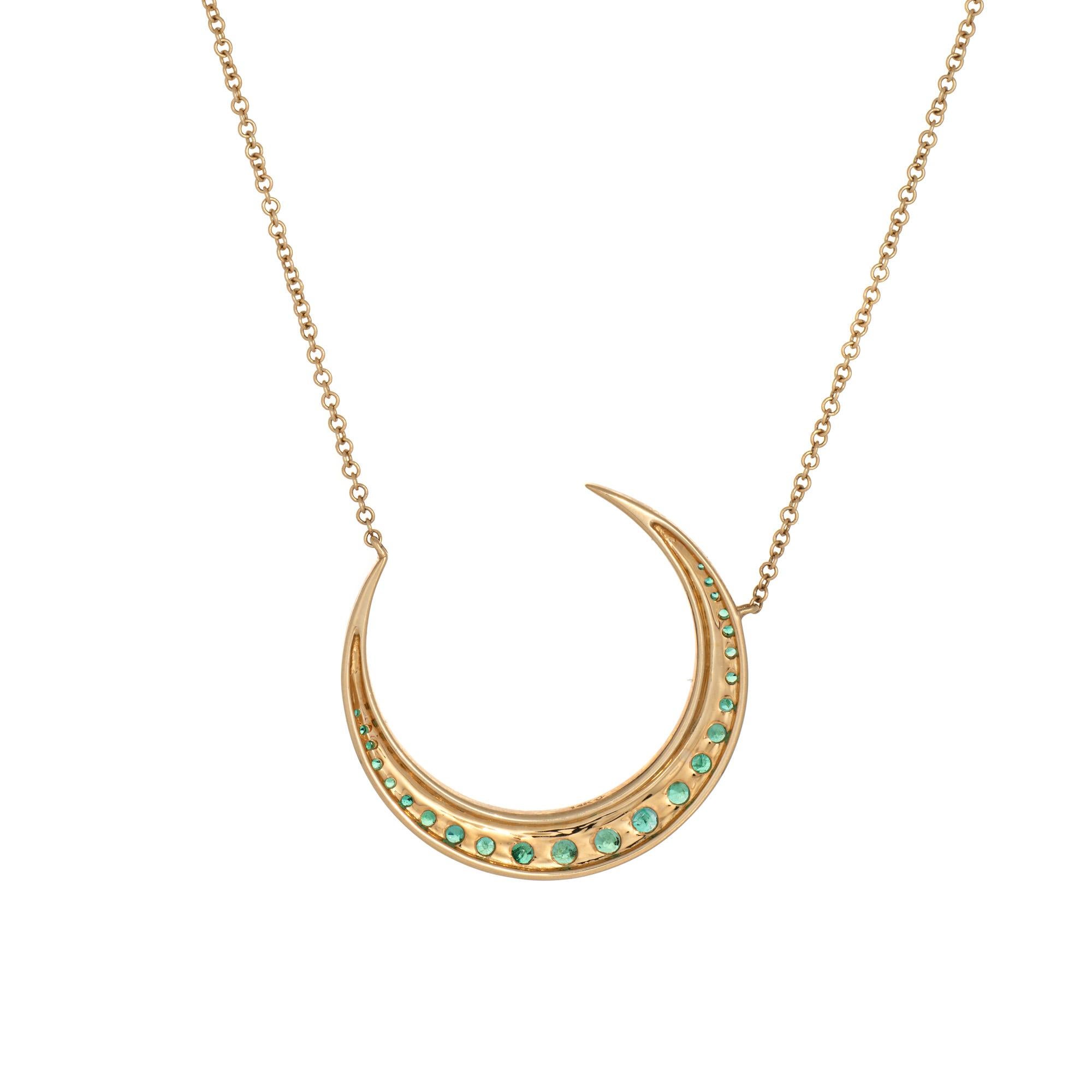 Stylish emerald & diamond crescent moon necklace crafted in 14 karat yellow gold.
Diamonds total an estimated 0.20 carats (estimated at I-J color and SI1-I1 clarity). Emeralds graduate in size from 1mm to 3mm. 

Set into a classic crescent moon