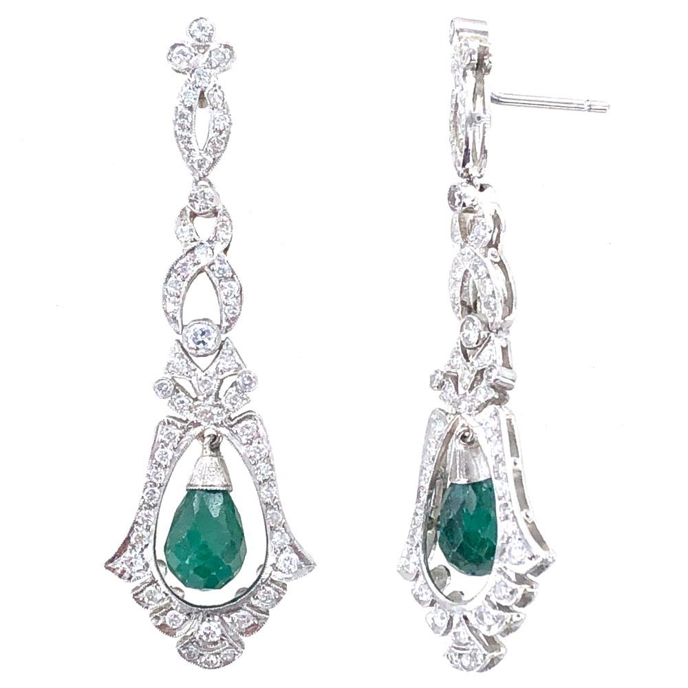 Emerald diamond Deco style drop earrings. These magnificant drop earrings feature briolette emerald gemstones and 1.25 carat total weight of white round brilliant cut diamonds. The earrings are crafted in platinum, measure 2.0 inches in length and
