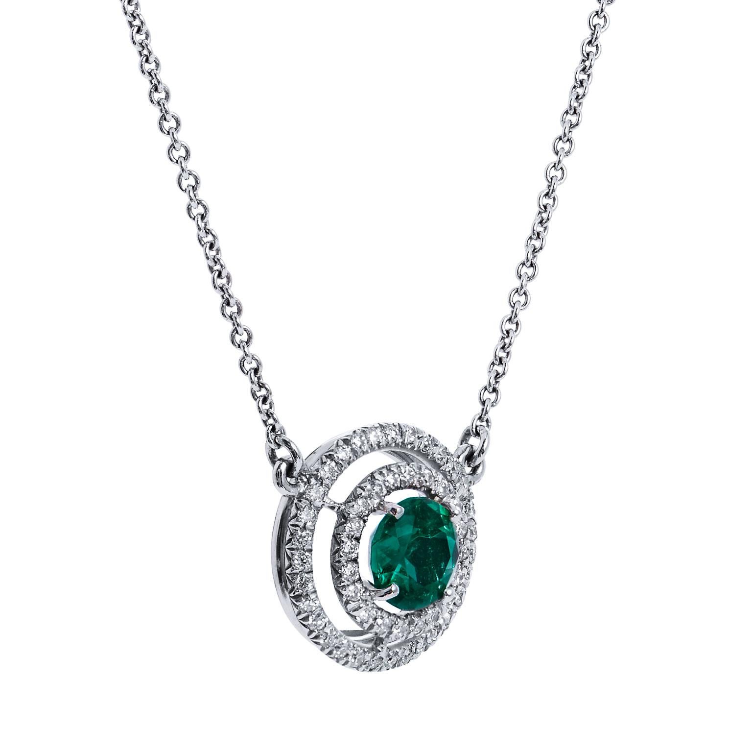 Emerald Diamond Double Halo Pendant Necklace

This stunning emerald and diamond pendant necklace is a one of a kind, handmade, one of a kind creation from H & H Jewels.

This necklace is handcrafted from 18kt white gold. It holds a .93 carat very
