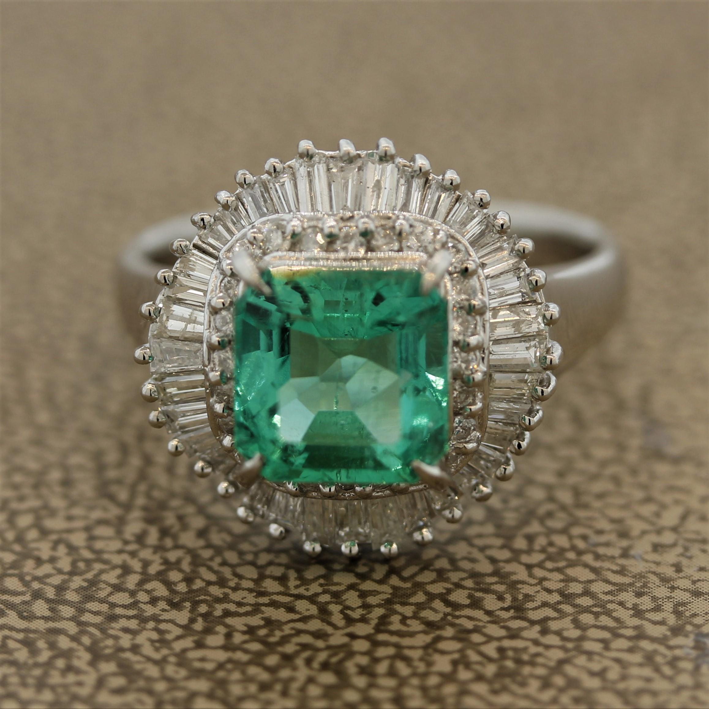 A classic emerald ring with a double halo. The emerald weighs 2.41 carats and is cut in a square shape. It is accented by a double-halo of round brilliant and baguette cut diamonds weighing a total of 0.88 carats. Hand-fabricated in platinum.

Ring