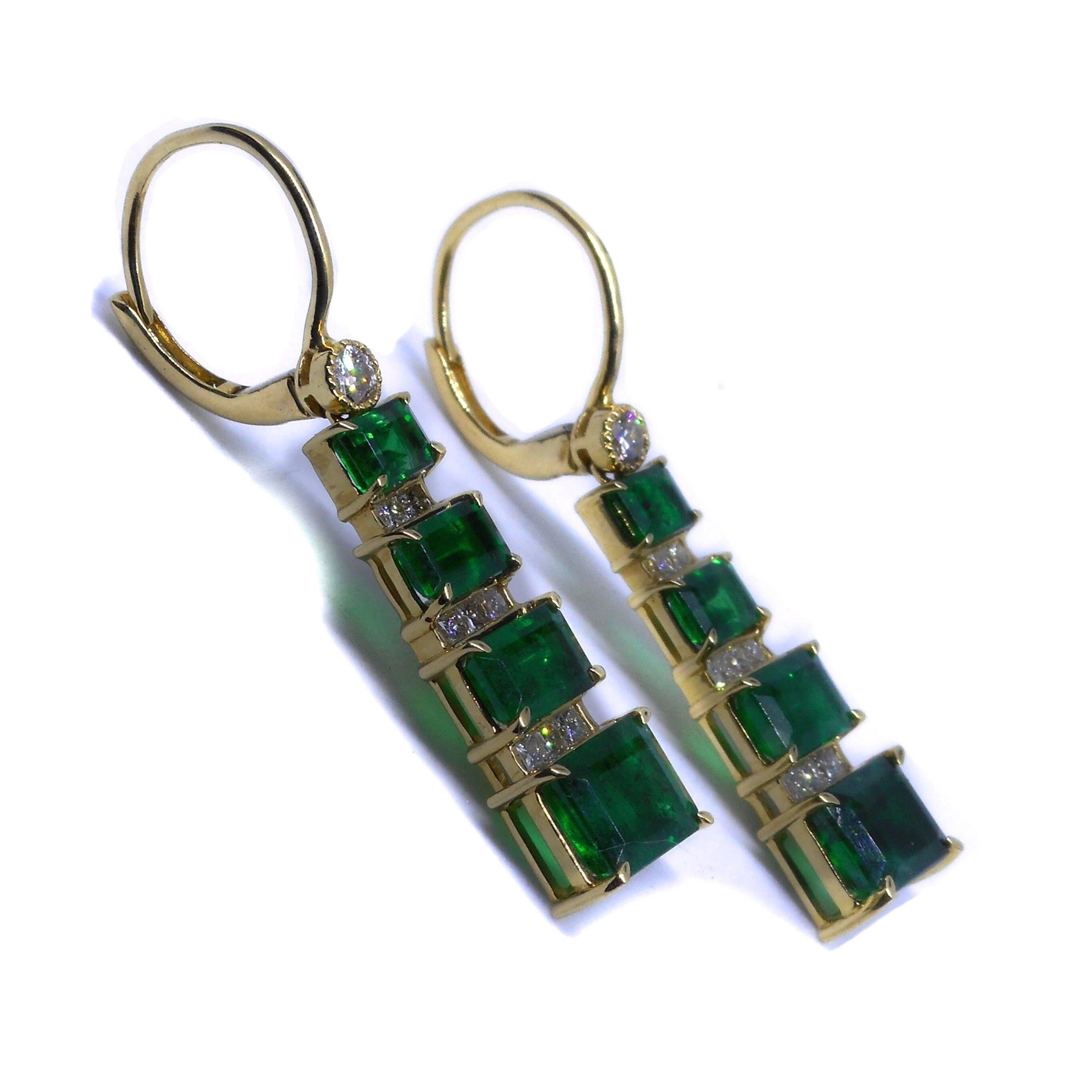 A PAIR OF 18CT GOLD EMERALD AND DIAMOND EARRINGS by Cartmer Jewellery
Certificate Valuation $18,860
Each a tapered drop set with 4 graduated step cut emeralds, adjacent to 8 princess cut diamonds, surmounted by a round brilliant cut diamond on a